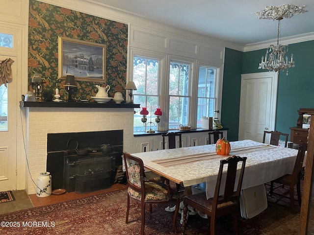 6056 Main St, Hamilton, NJ 08330 - dining space featuring a notable chandelier, ornamental molding, and a brick fireplace