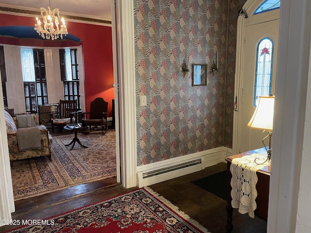 6056 Main St, Hamilton, NJ 08330 - foyer entrance with a chandelier, wood-type flooring, a baseboard radiator, and crown molding