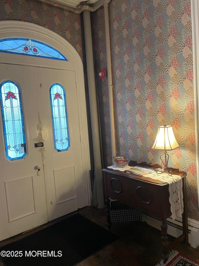 6056 Main St, Hamilton, NJ 08330 - foyer entrance featuring a baseboard heating unit