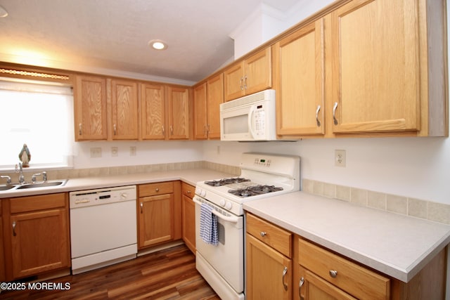 kitchen with dark wood-style flooring, recessed lighting, white appliances, light countertops, and a sink