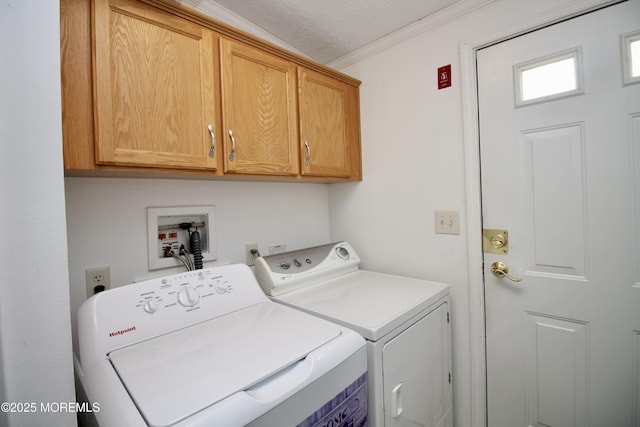 washroom with independent washer and dryer, ornamental molding, and cabinet space