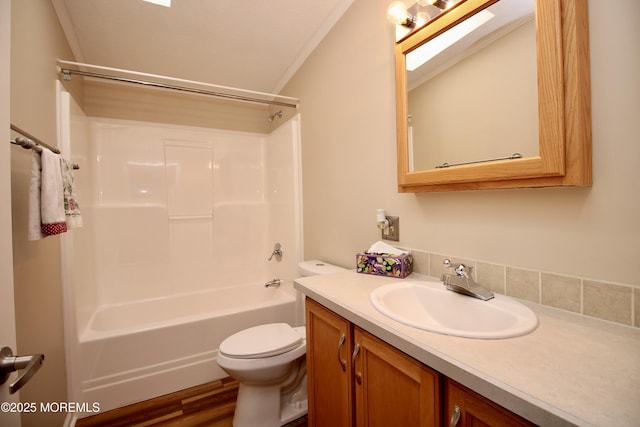 bathroom featuring toilet, shower / bath combination, wood finished floors, and vanity