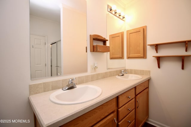 bathroom featuring double vanity, a sink, and ornamental molding