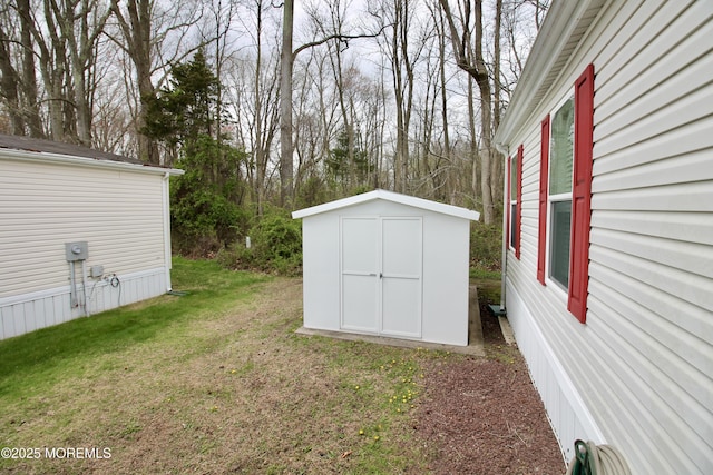 view of yard with an outdoor structure and a storage unit