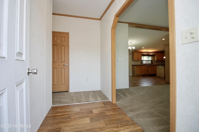 2 Brookside Way, Freehold, NJ 07728 - hallway featuring wood finished floors, a chandelier, carpet flooring, recessed lighting, and a sink