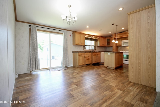 2 Brookside Way, Freehold, NJ 07728 - kitchen featuring white appliances, a chandelier, wood finished floors, ornamental molding, and a center island