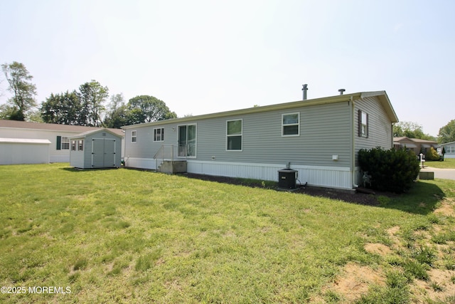 2 Brookside Way, Freehold, NJ 07728 - rear view of property with a yard and central AC unit