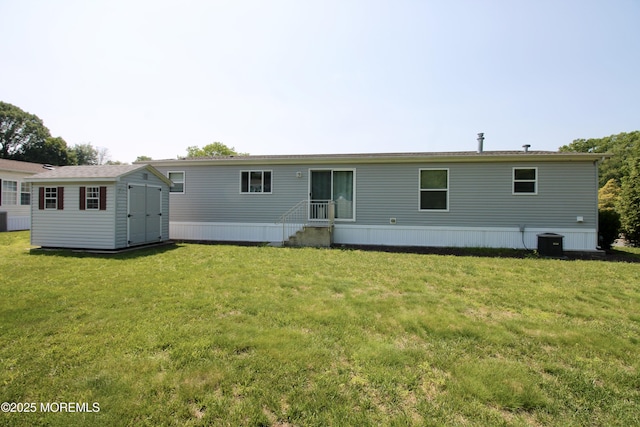 2 Brookside Way, Freehold, NJ 07728 - rear view of house with central AC unit, a lawn, and entry steps