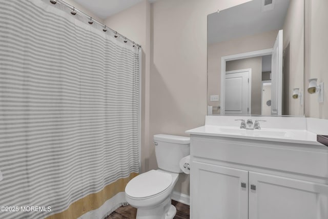 full bathroom with visible vents, vanity, a shower with shower curtain, and toilet