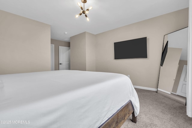 bedroom featuring an inviting chandelier, baseboards, and carpet floors