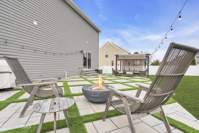 exterior space featuring a fenced backyard, entry steps, and an outdoor living space with a fire pit