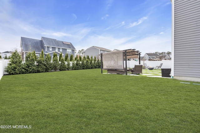 view of yard featuring a fenced backyard, a pergola, a residential view, and a patio