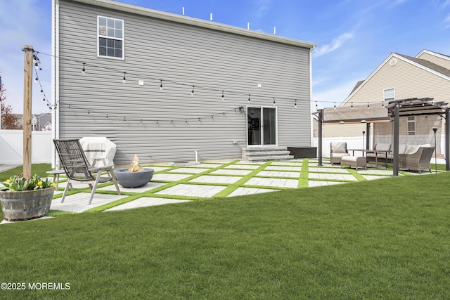 rear view of property featuring a pergola, a patio area, fence, an outdoor living space with a fire pit, and a yard