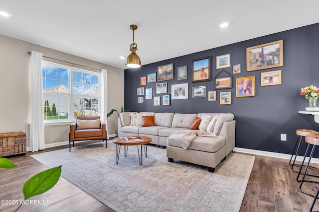 living room featuring recessed lighting, wood finished floors, and baseboards