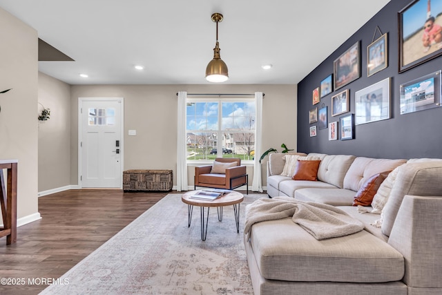 living room with baseboards, wood finished floors, and recessed lighting
