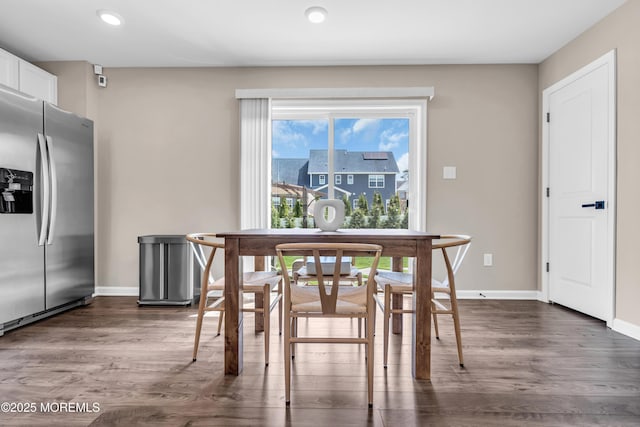 dining space with baseboards, recessed lighting, and dark wood-style flooring