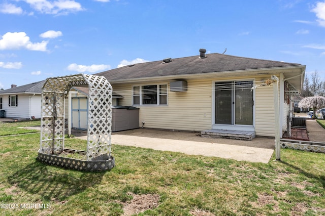 back of property with a yard, a patio area, and a vegetable garden