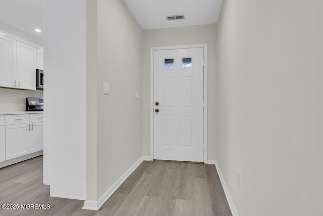 1396 Gleniffer Hill Rd, Toms River, NJ 08755 - doorway to outside with light wood-type flooring, baseboards, and visible vents