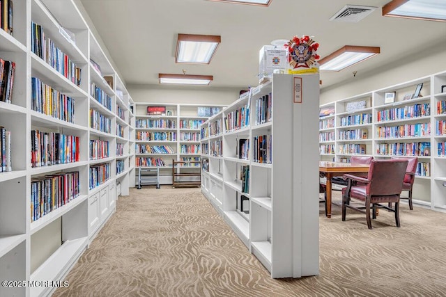 1396 Gleniffer Hill Rd, Toms River, NJ 08755 - sitting room with bookshelves, visible vents, and carpet