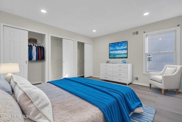 1396 Gleniffer Hill Rd, Toms River, NJ 08755 - bedroom featuring wood finished floors, visible vents, baseboards, and multiple closets