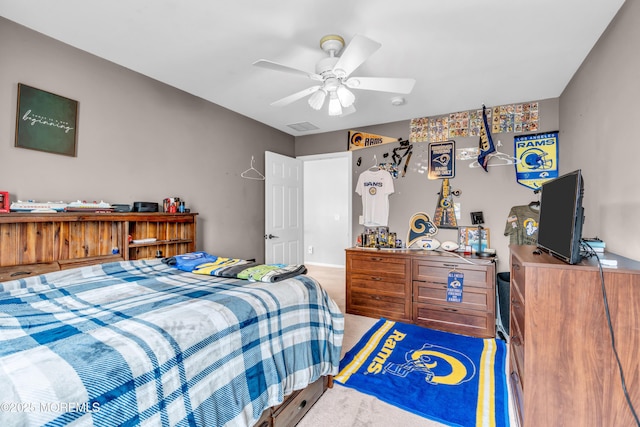 bedroom featuring light carpet, ceiling fan, and visible vents