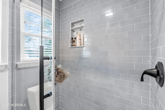 bathroom with a shower stall