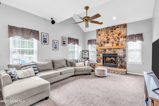 living room with baseboards, a stone fireplace, a ceiling fan, carpet floors, and lofted ceiling