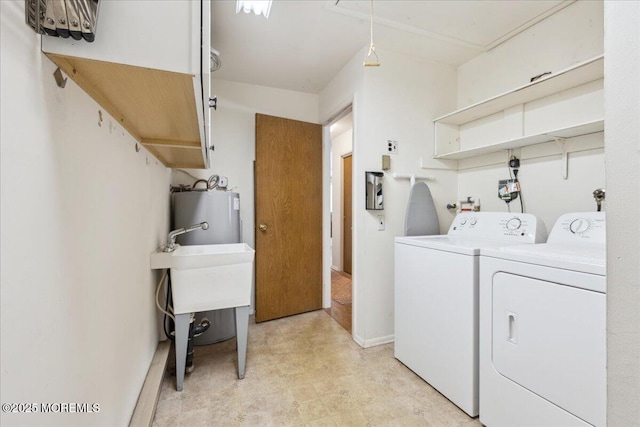 laundry room featuring light floors, washer and dryer, and water heater