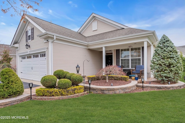 ranch-style home featuring a front lawn and roof with shingles