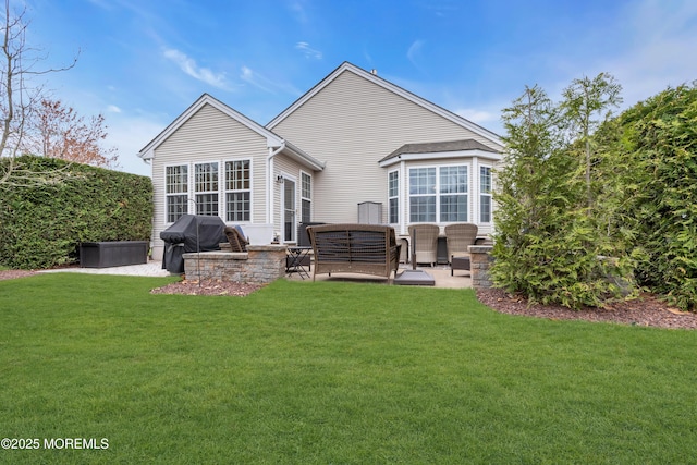 back of property featuring a patio area and a lawn
