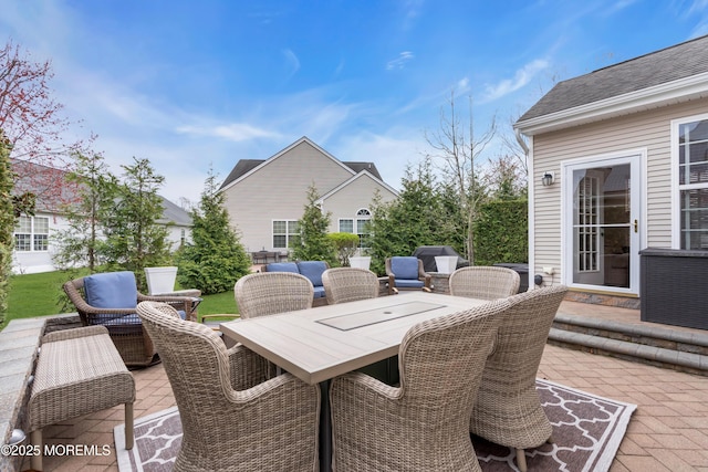 view of patio / terrace with outdoor dining area and an outdoor hangout area