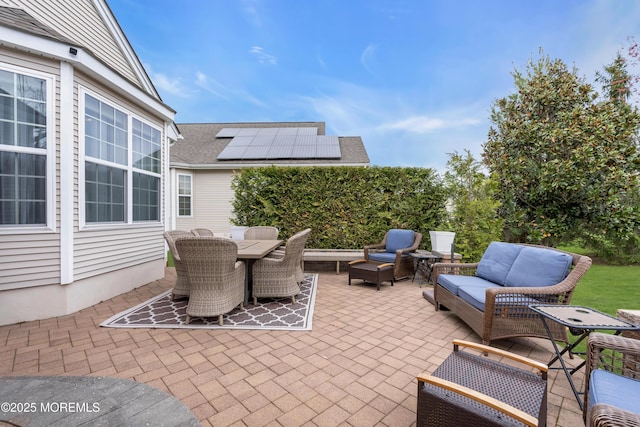 view of patio / terrace with an outdoor living space and outdoor dining area