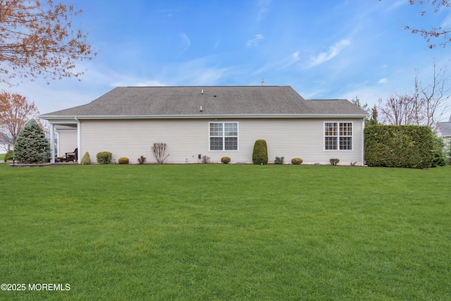 back of house featuring a lawn