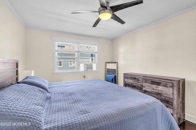 bedroom featuring ornamental molding, a ceiling fan, cooling unit, and wood finished floors