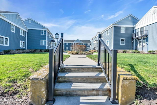 surrounding community featuring a residential view and a lawn