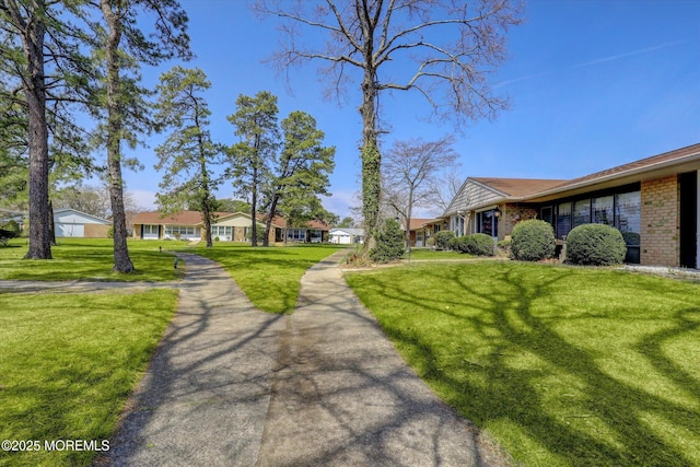 exterior space featuring a yard and a residential view