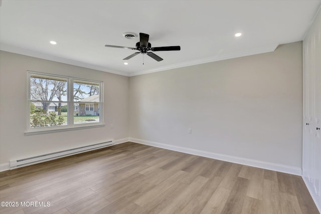 empty room featuring visible vents, a baseboard radiator, a ceiling fan, and wood finished floors
