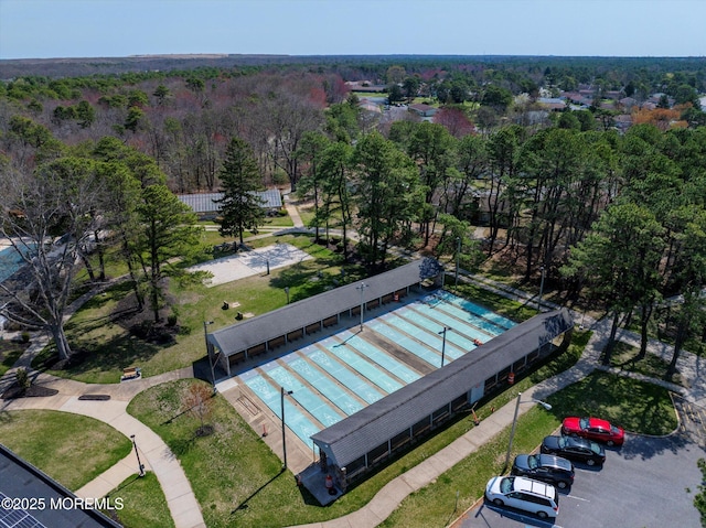 aerial view featuring a wooded view