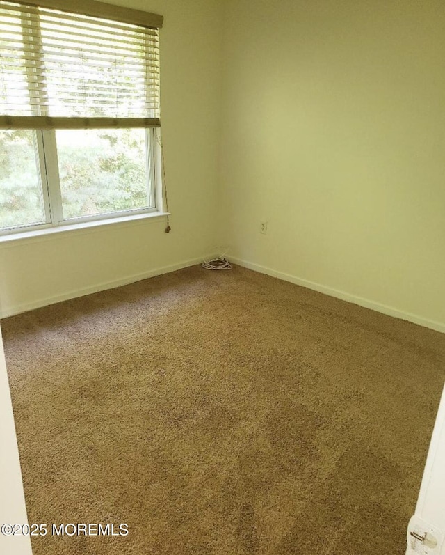96 Drew Ct, Manalapan, NJ 07726 - carpeted empty room featuring baseboards