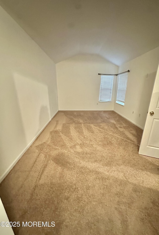 96 Drew Ct, Manalapan, NJ 07726 - bonus room featuring baseboards, carpet flooring, and vaulted ceiling