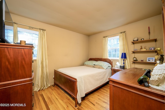 bedroom with light wood finished floors