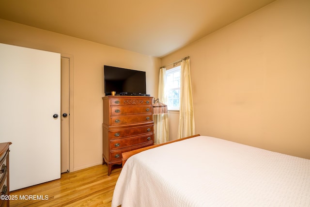 bedroom featuring light wood-style flooring