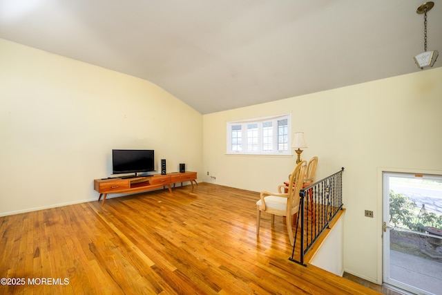 sitting room featuring wood finished floors and lofted ceiling