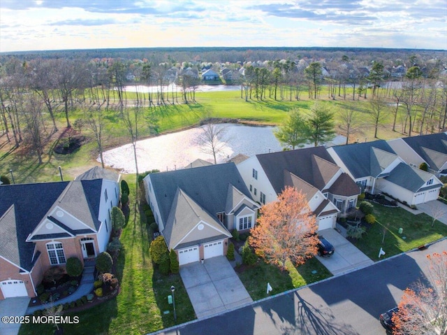bird's eye view with a residential view and a water view