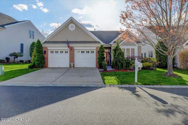 view of front facade featuring concrete driveway, a front yard, brick siding, and a garage
