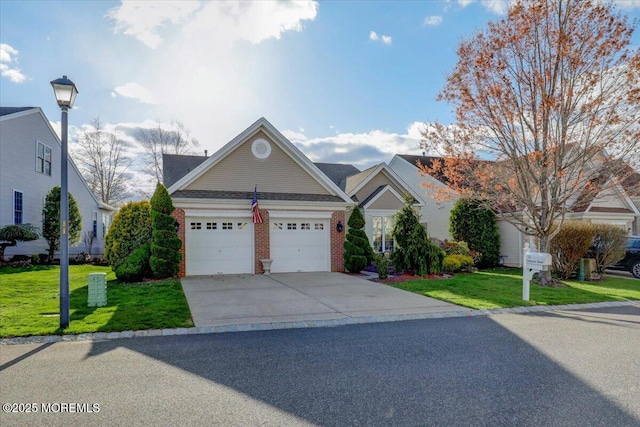 view of front facade featuring concrete driveway, a front yard, brick siding, and a garage