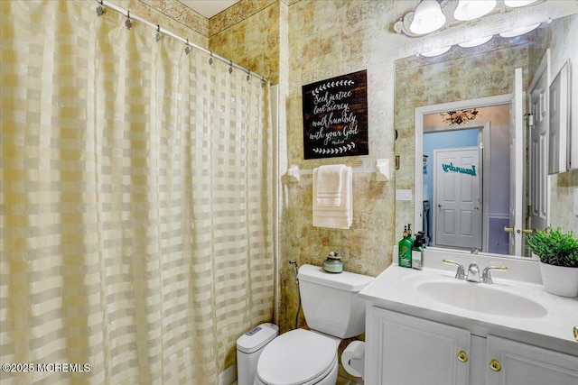 full bath with toilet, curtained shower, wallpapered walls, and vanity