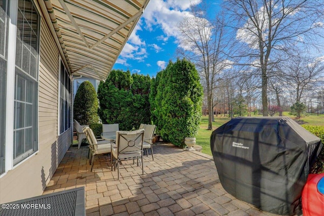 view of patio featuring a grill and outdoor dining area