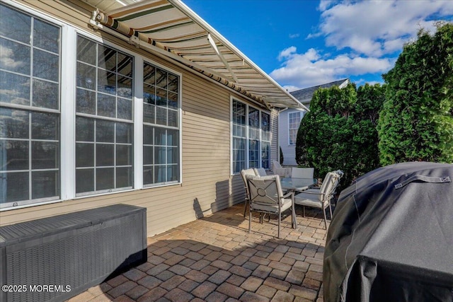 view of patio / terrace featuring grilling area and outdoor dining area