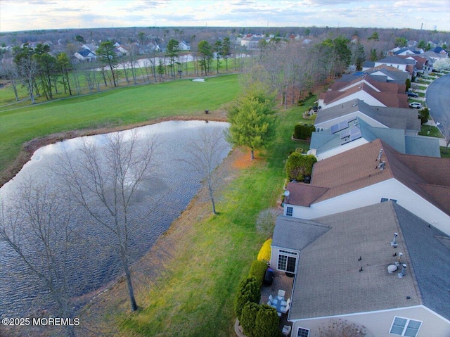 drone / aerial view featuring a residential view and a water view
